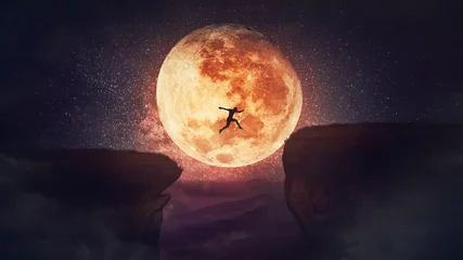 Papier Peint photo Lavable Pleine lune Surreal scene, self overcome concept, as determined man jump over a chasm obstacle. Way to win and success over starry night with full moon background. Motivation for achieving goals.