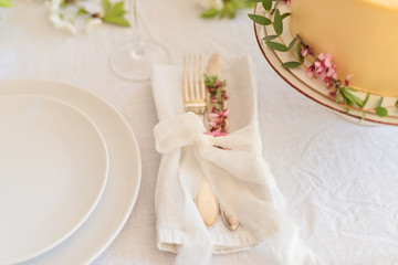 Obraz na płótnie Canvas Dishes and cutlery, boho wedding table setting