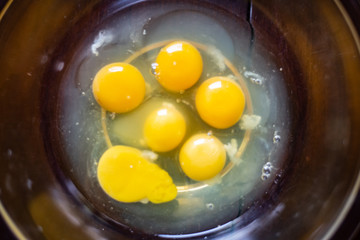 Photograph of eggs in a bowl ready for the recipe.