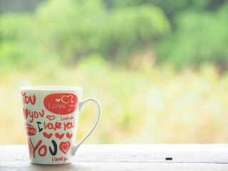 cup of coffee on wooden table