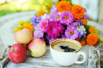 Cup of coffee and flowers