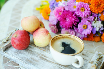 Cup of coffee and flowers