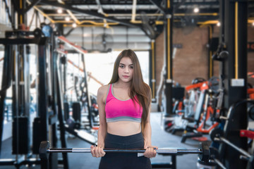 Fototapeta na wymiar Beautiful asian woman play fitness in the gym,Thailand girl has a slim body,Time for exercise,People love heath,Stretching body before workout,Sport woman warm up body,planking on floor