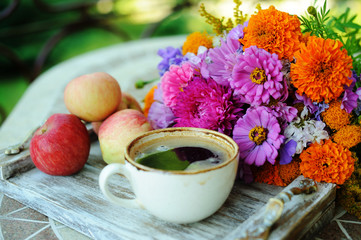 Cup of coffee and flowers