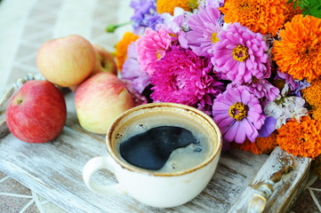 Cup of coffee and flowers
