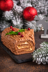 Christmas yule log cake. Traditional chocolate dessert