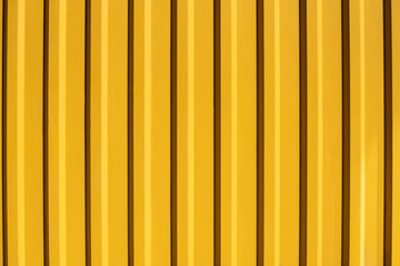 Metal yellow profile sheet for roofs or walls, beautiful yellow textured background