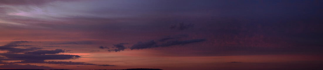 Evening, summer sunset. Panoramic photo, late afternoon, alarming, red sunset.