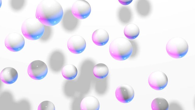 Motion and jumping white and colorful balls on a light background