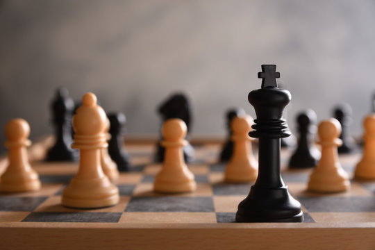 board game for ideas and strategy, business success concept. hand of businessman man moving chess figure in competition success play.  strategy, management or leadership concept.playing photographed 