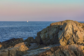 Fototapeta na wymiar Small Sailboat Off Coast Of Maine