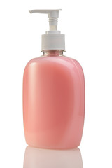 Pink bottle of liquid soap or gel with a pump on a white isolated background close-up.