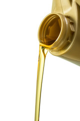 Filling engine oil from a golden canister. Canister with a splash of engine oil isolated on a white background close-up.
