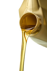 Filling engine oil from a golden canister. Canister with a splash of engine oil isolated on a white background close-up.