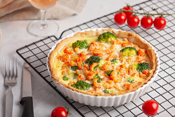 Home made french tart quiche with crayfish and broccoli filled with cream and eggs.