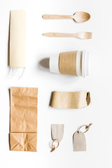 food delivery workdesk with paper bags and plastic cup table background top view mock-up