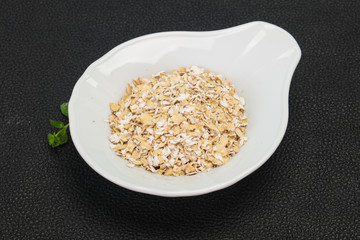 Raw oats in the bowl