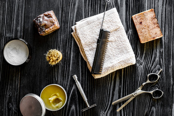 Tools for cutting beard barbershop top view on wooden background