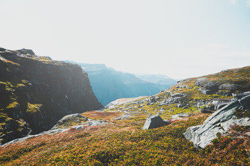 Fototapeta na wymiar Travel around Norwegian national park at autumn season, hiking in mountains.