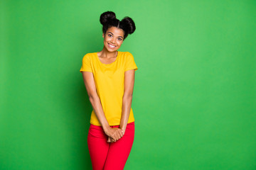 Photo of beautiful dark skin lady came to birthday party shy to speak first to handsome guy wear casual yellow t-shirt and red pants isolated green background