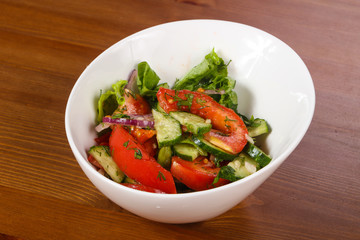Vegetable salad with tomato, cucumbers