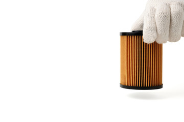 Car Oil Filters is picked up by hands of men wear white gloves.