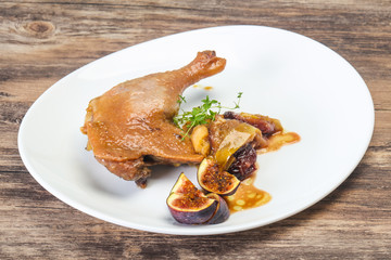 Roasted. duck. leg with plum and apple