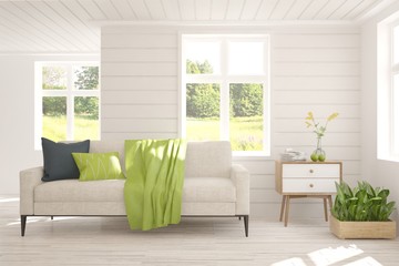 Stylish room in white color with sofa and summer landscape in window. Scandinavian interior design. 3D illustration