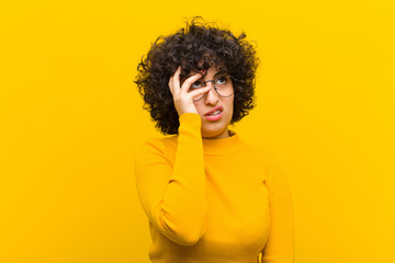 young pretty afro woman feeling bored, frustrated and sleepy after a tiresome, dull and tedious...