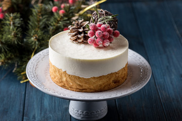 Double Christmas heesecake with berries on a dark background