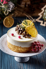 Double Christmas cheesecake with berries on a dark background