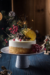 Fototapeta na wymiar Double cheesecake with berries on a dark background