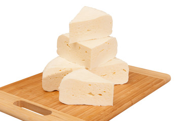 cheese on a wooden board