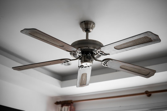 Picture Of Wooden Ceiling Fan Inside The Living Room.