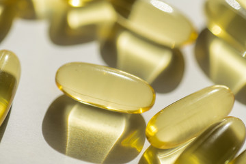 capsules of fish fat oil vitamin for heart, omega 3, macro