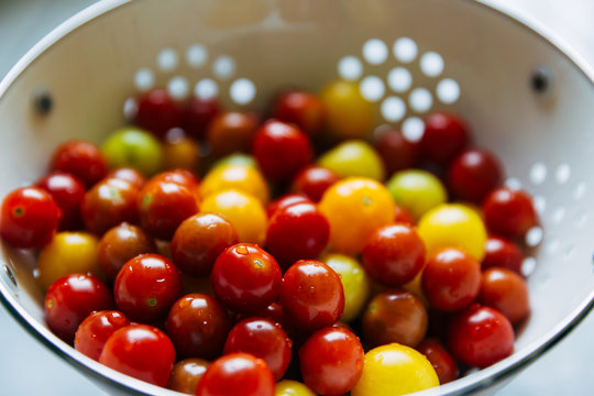 tomatoes in a colander after washing