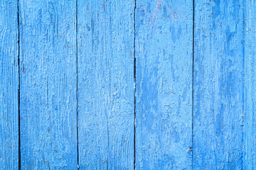 Blue wooden background. Blue faded painted wooden texture, background, wallpaper. Wooden background, painted surface blue boards.  Weathered blue wood background texture. Vertical  planks