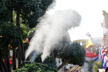 mist nozzle sprays cold water create mist on a hot day,open air cooling system on summer