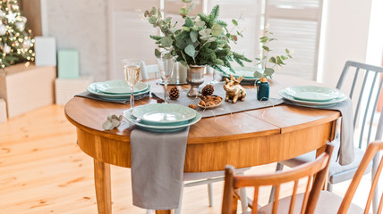 Festive christmas table with dish and bouquet