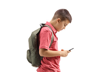 Teenage schoolboy looking at a mobile phone