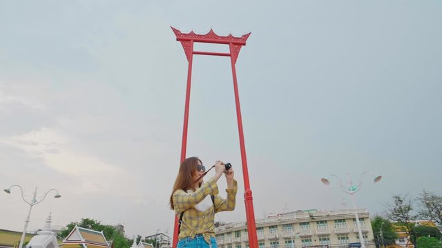 Traveler woman take a photo in Bangkok at Giant swing landmark in the city / Sao Ching Cha, Amazing Travel