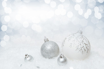White Christmas background with snowflakes and Christmas decorations.