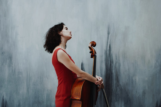 Young woman with cello instrument