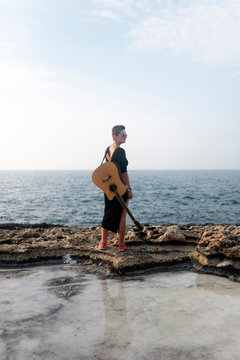 Young woman playing a guitar