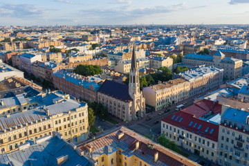 Fototapeta premium Crossroads on Vasilyevsky Island, view from the drone, Lutheran Church of St. Michael in St. Petersburg