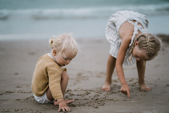 Sisters playing on a beach