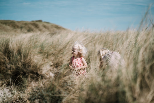 Sisters playing in a summer field