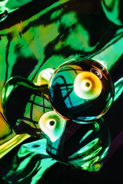 Abstract composition with colorful holographic background and crystal ball