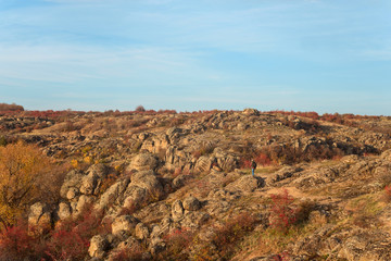 Bactive, active rest, activity, adult, adventure, autumn, background, backpack, bearded man, canyon, clack of an old male tourist with a gray beard against the backdrop of mountains, rocks and forests