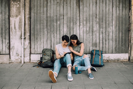 Young Asian Couple In Love Enjoying Their Vacation